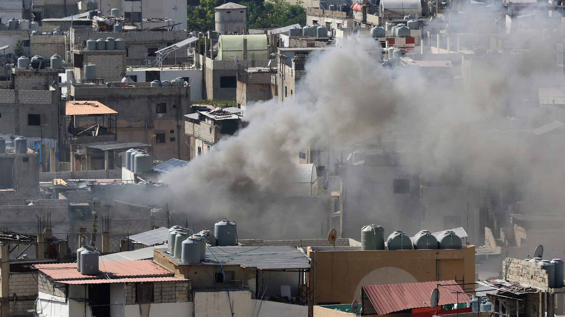 Image for the title: Four dead as renewed clashes hit Lebanon Palestinian camp 