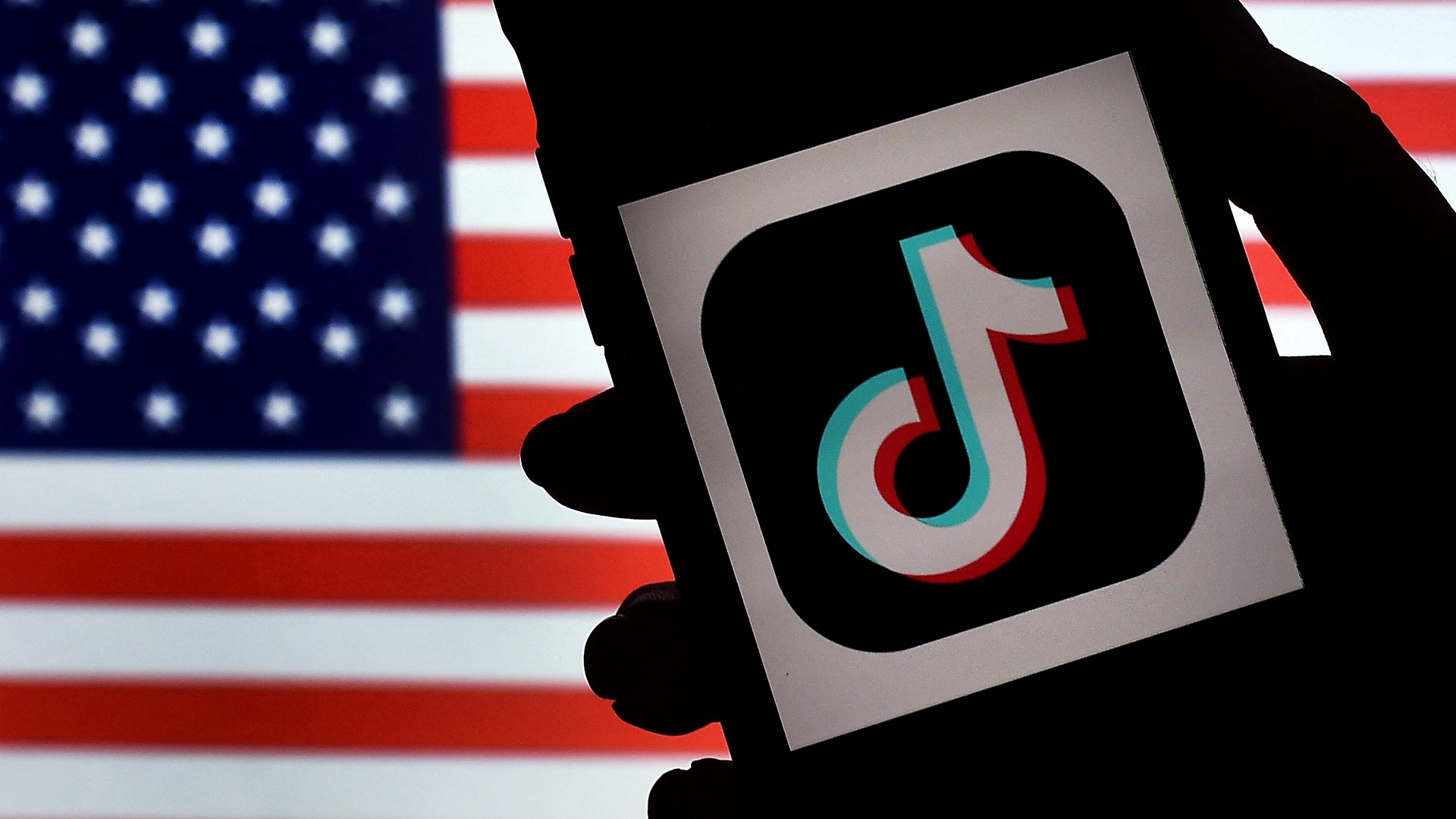 Image for the title: Bill to ban TikTok in US moves ahead in Congress 