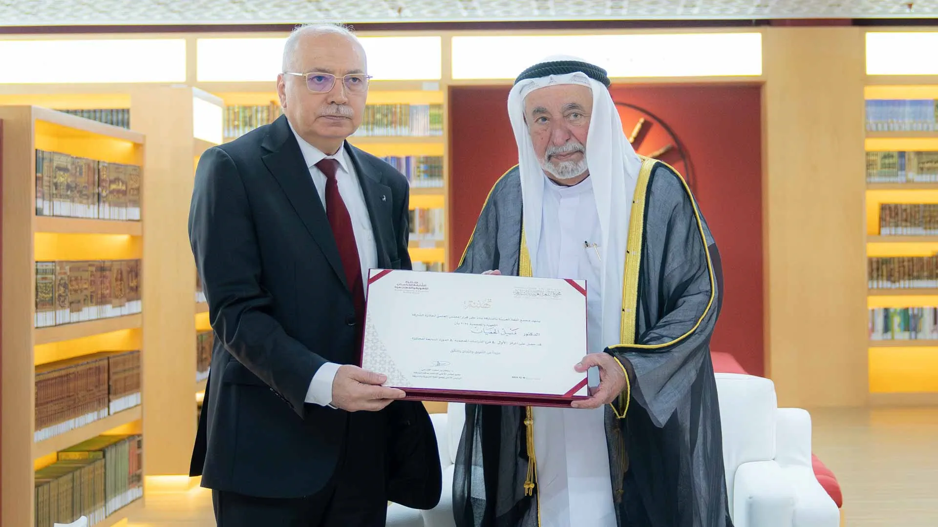 Sharjah Ruler hands over a certificate for winner