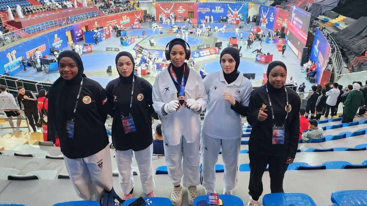 Image for the title: Salma and Sara Al Ketbi win bronze medals in Arab Taekwondo Chip. 