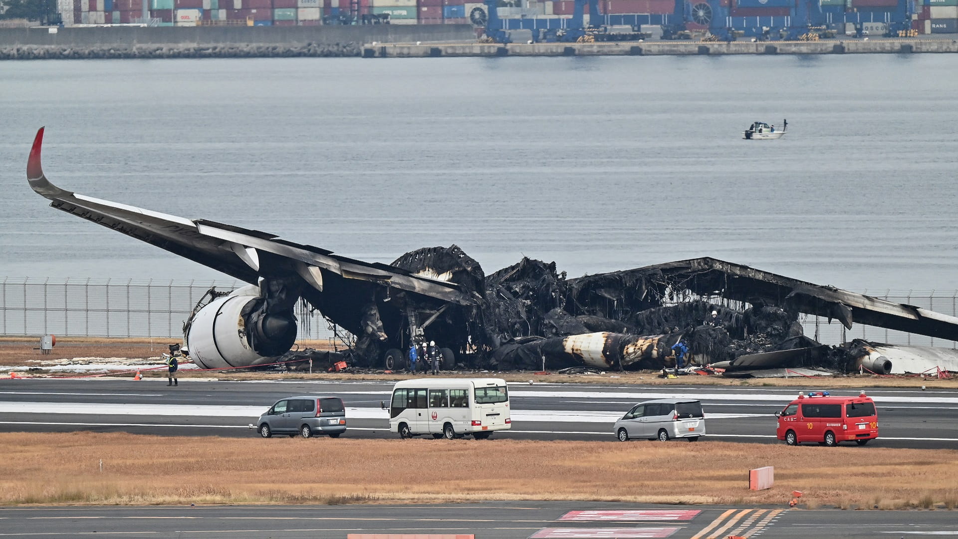 Image for the title: Japan investigators probe conflicting reports on plane crash 