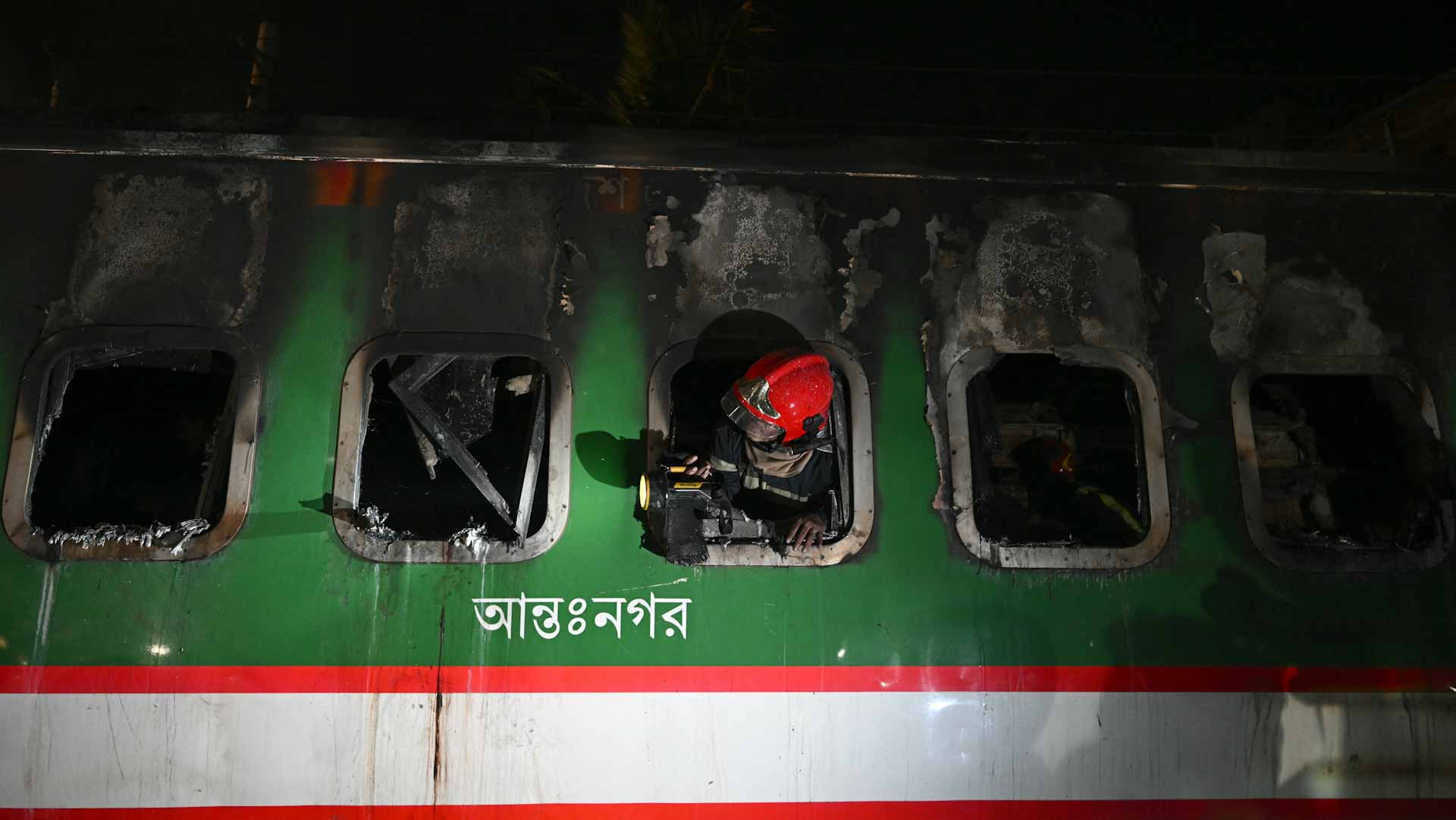 Image for the title: 5 killed as packed train catches fire in Bangladesh 