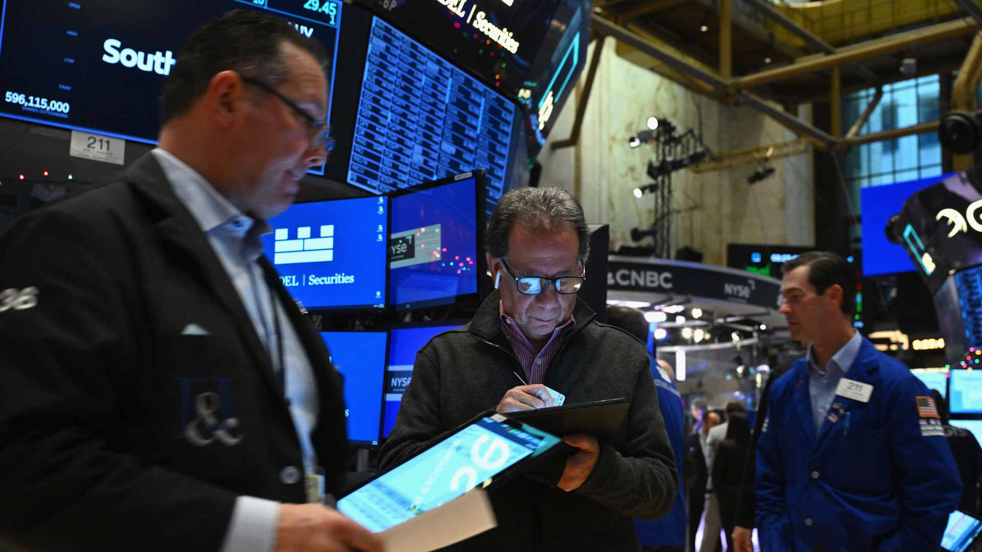Image for the title: US stocks mixed, ending S&P 500 streak of records 
