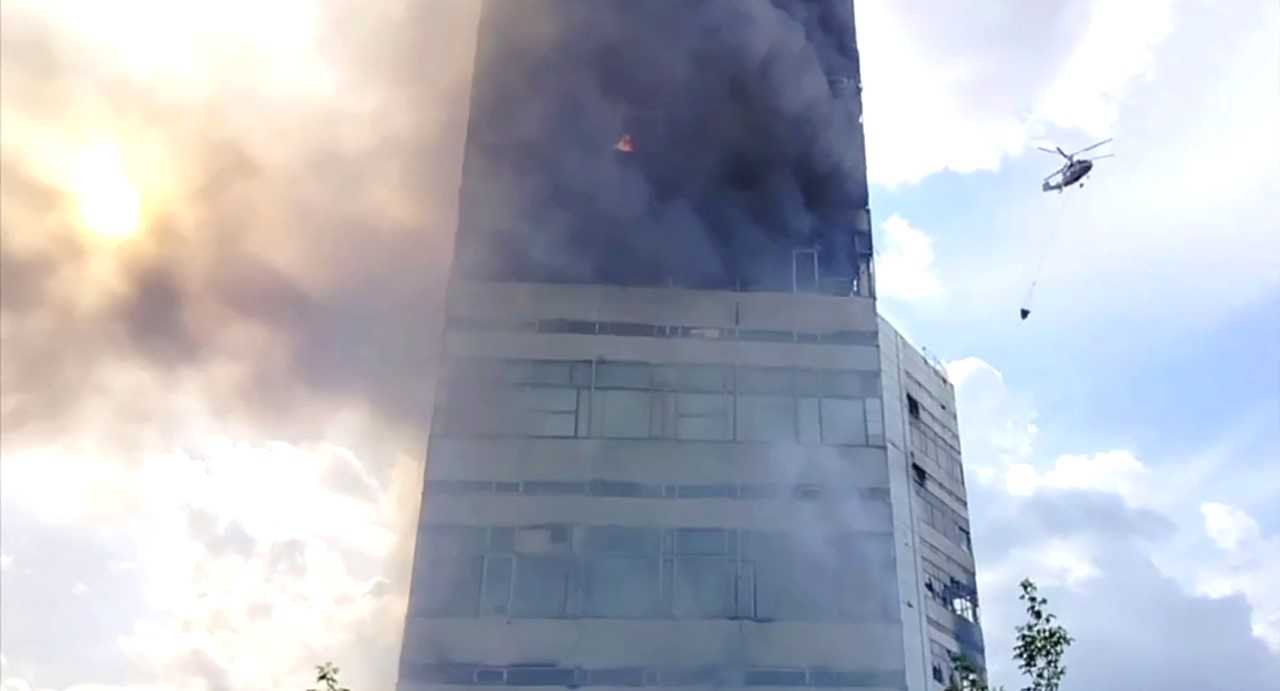 Image for the title: At least two dead as fire engulfs Russian office block 