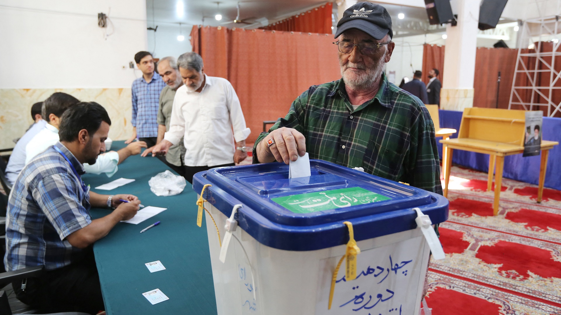 Image for the title: Iran begins voting in presidential election 