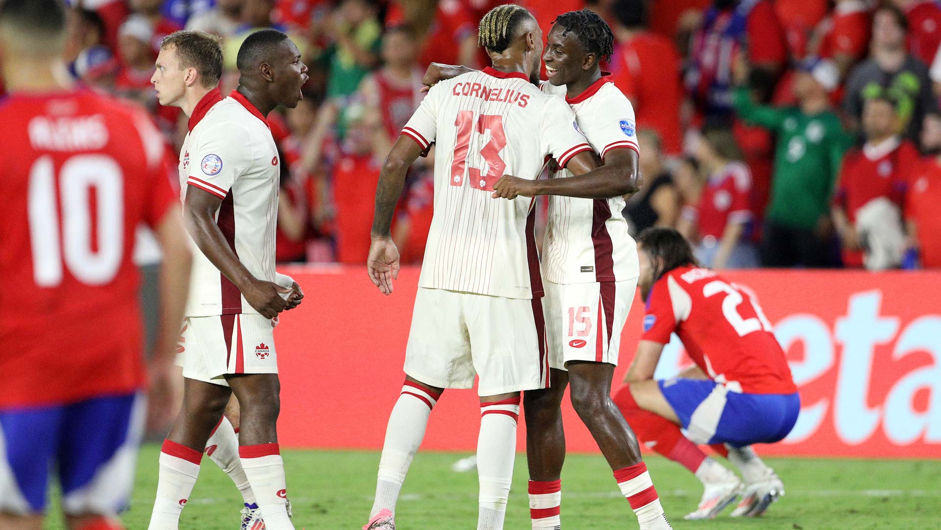 Image for the title: Canada into Copa America quarter-finals after draw with Chile 