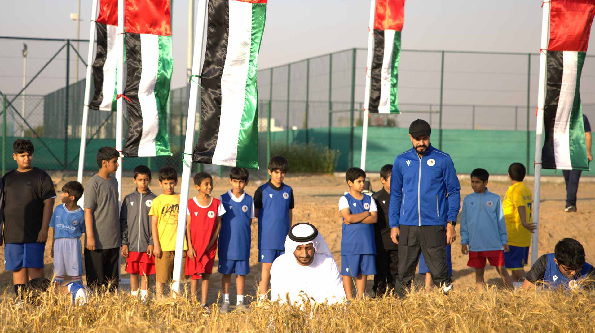 Image for the title: Mleiha players cultivate wheat for agricultural sustainability 