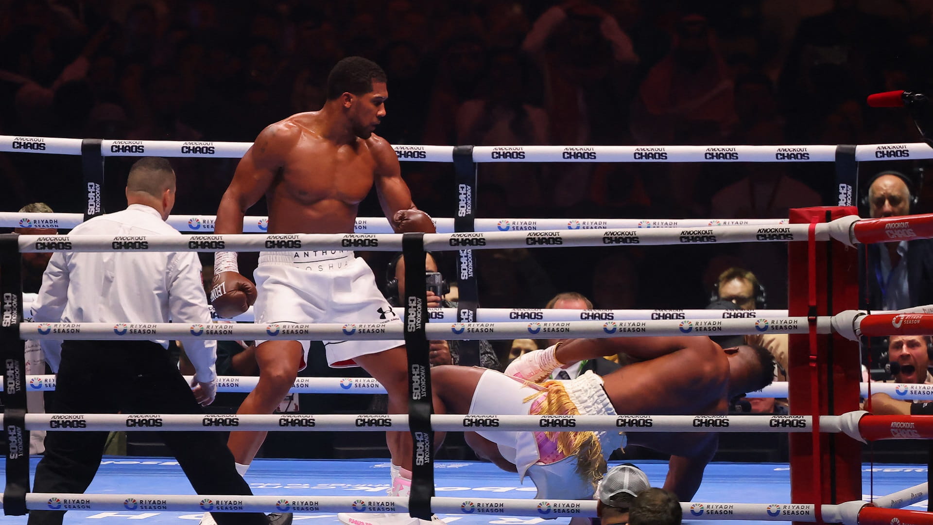 Image for the title: Joshua defeats Ngannou with brutal second-round KO 