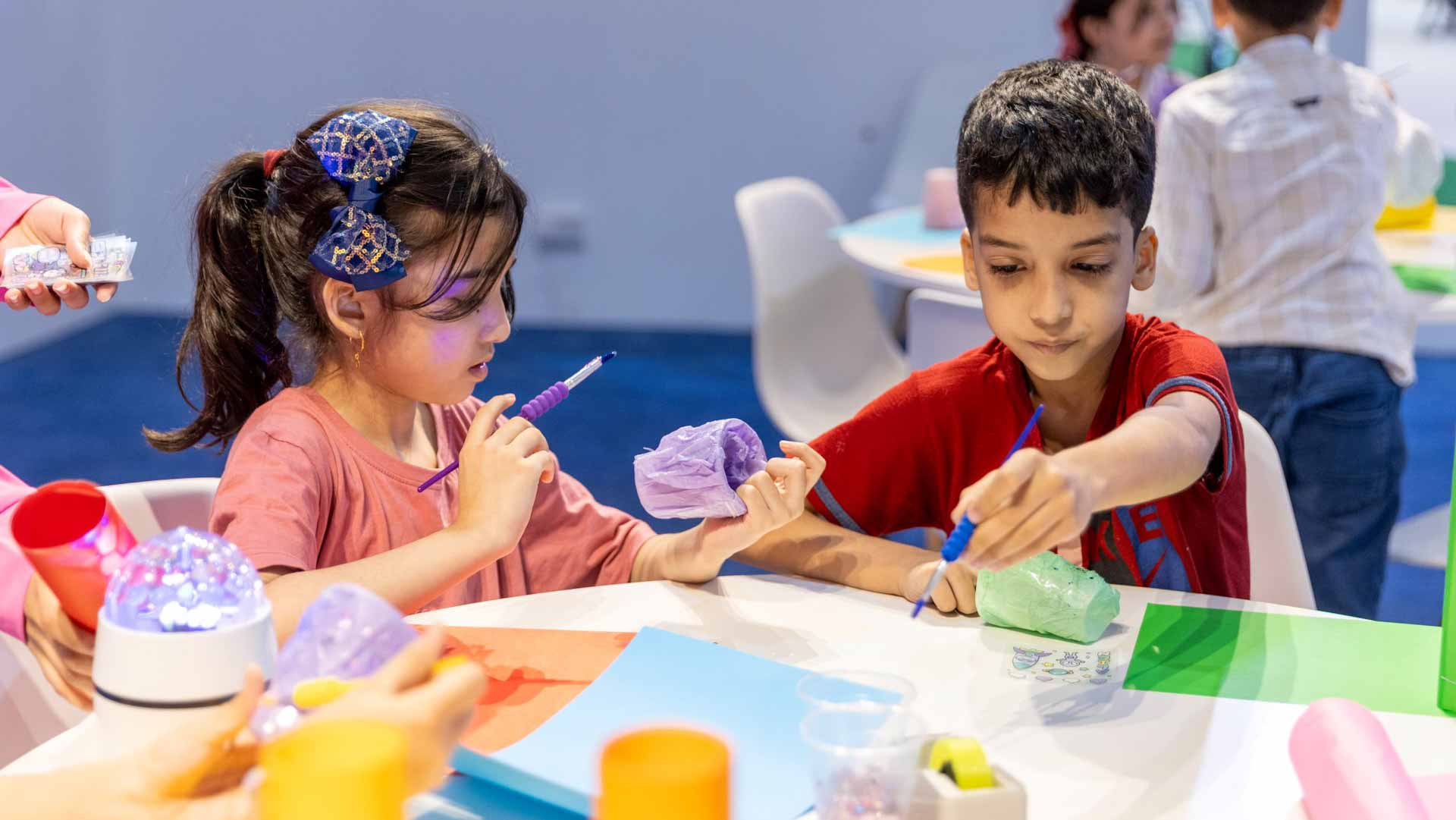Image for the title: Children make telescopes to unravel mysteries of cosmos at SCRF 