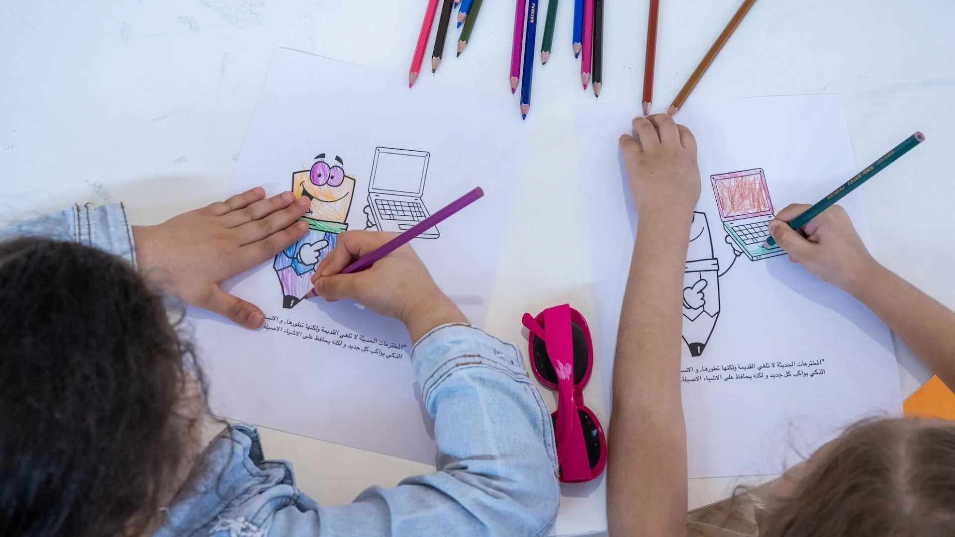 Image for the title: Pen, keyboard complement each other, children learn at SIBF 