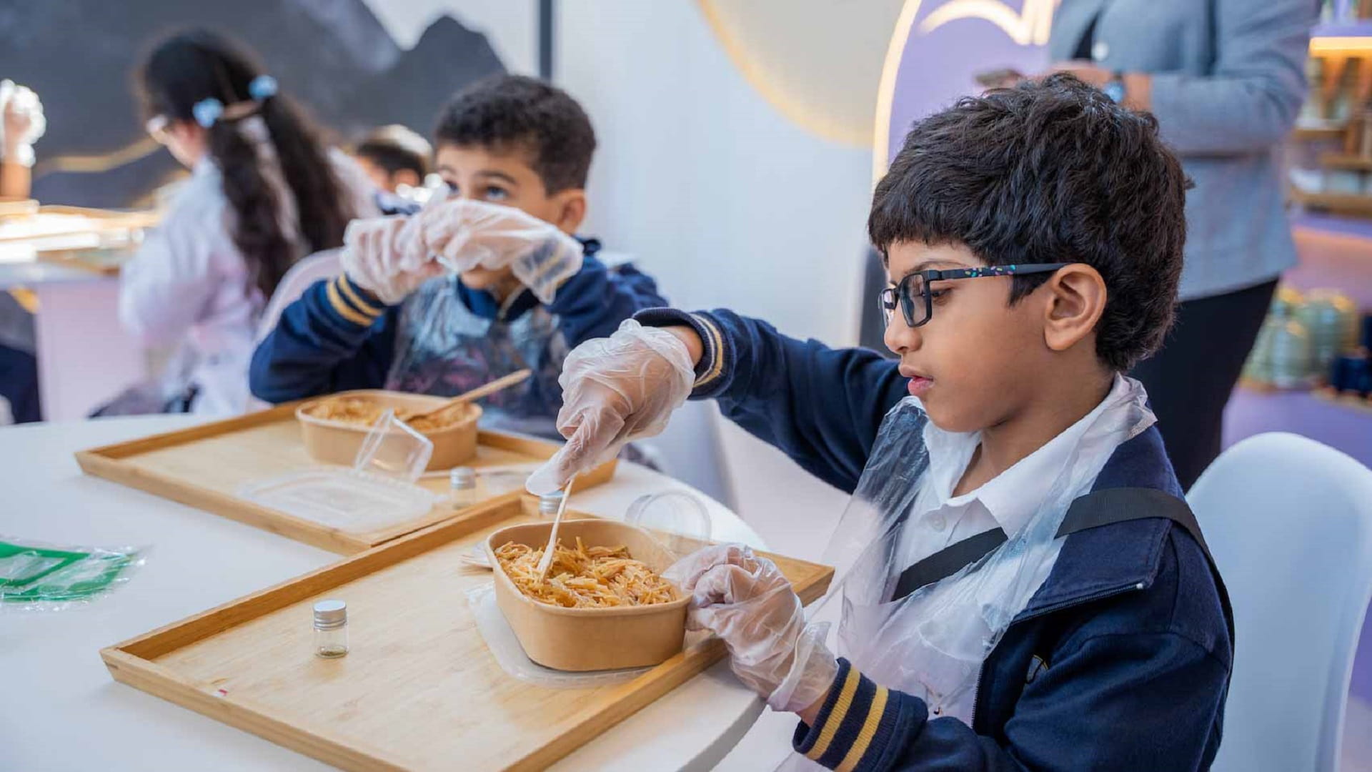 Image for the title: Young chefs whip up  delicious Emirati breakfast at SIBF 