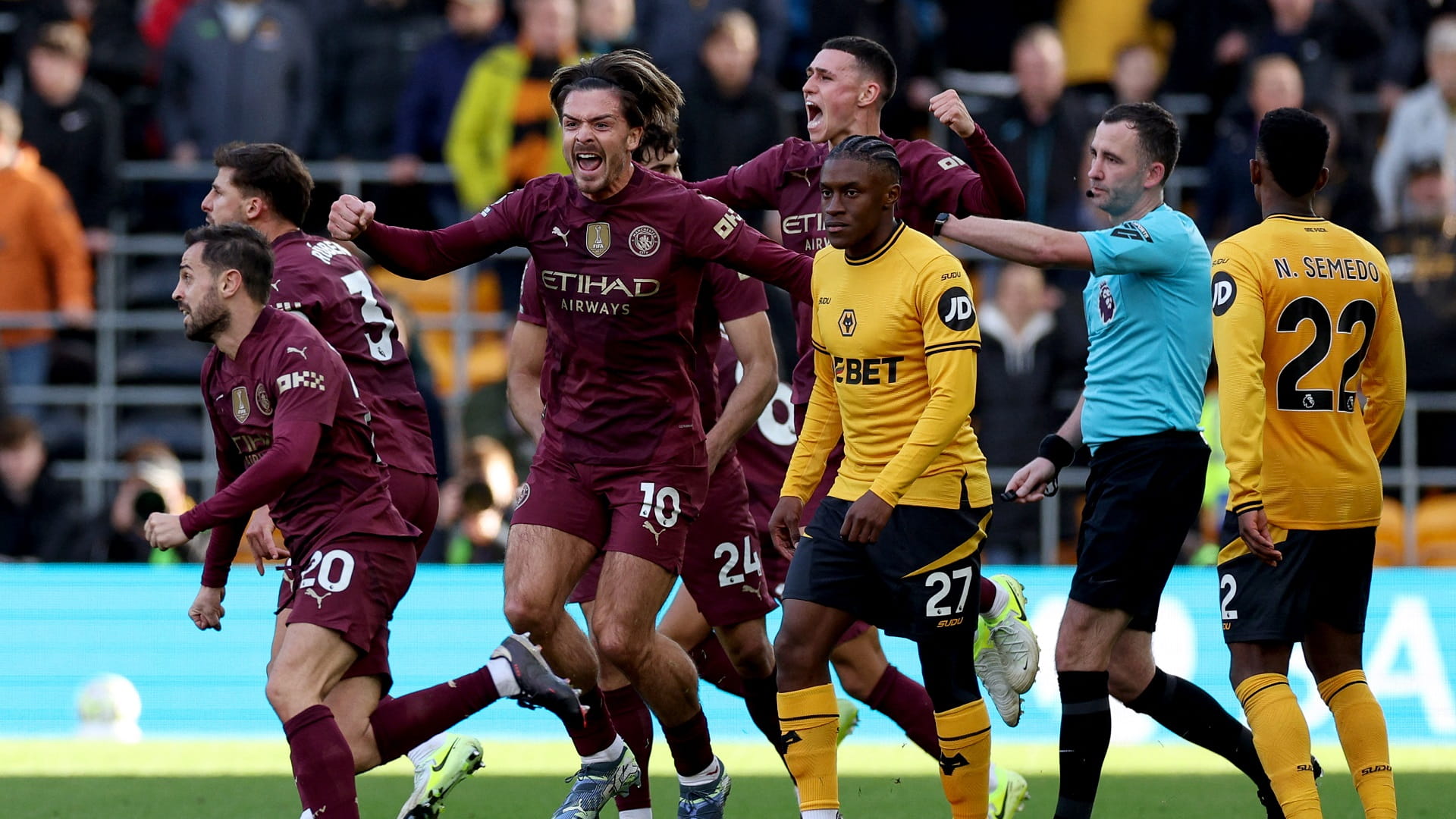 Image for the title: Stones bags controversial winner as Man City survive Wolves scare 