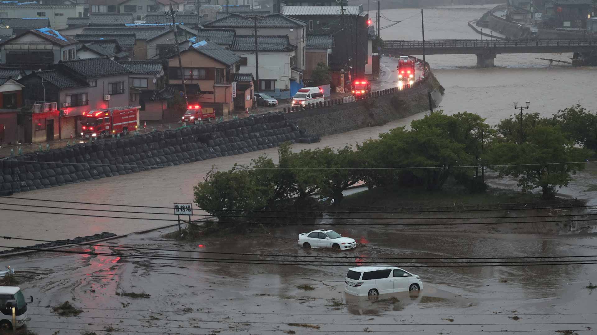 Floods, landslides hit central Japan months after major quake 