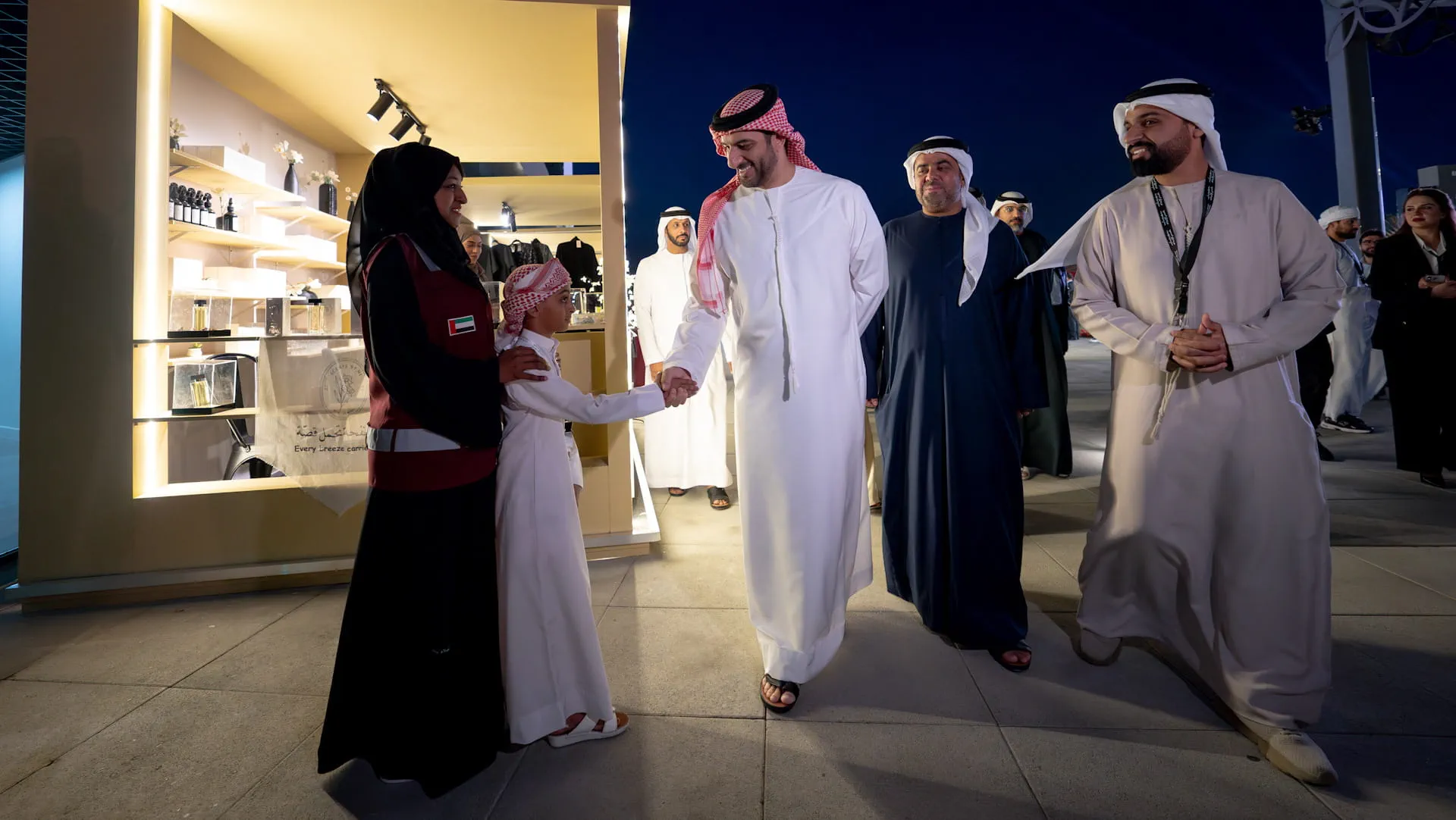 His Highness Sheikh Sultan bin Ahmed shakes hand with guests of the event