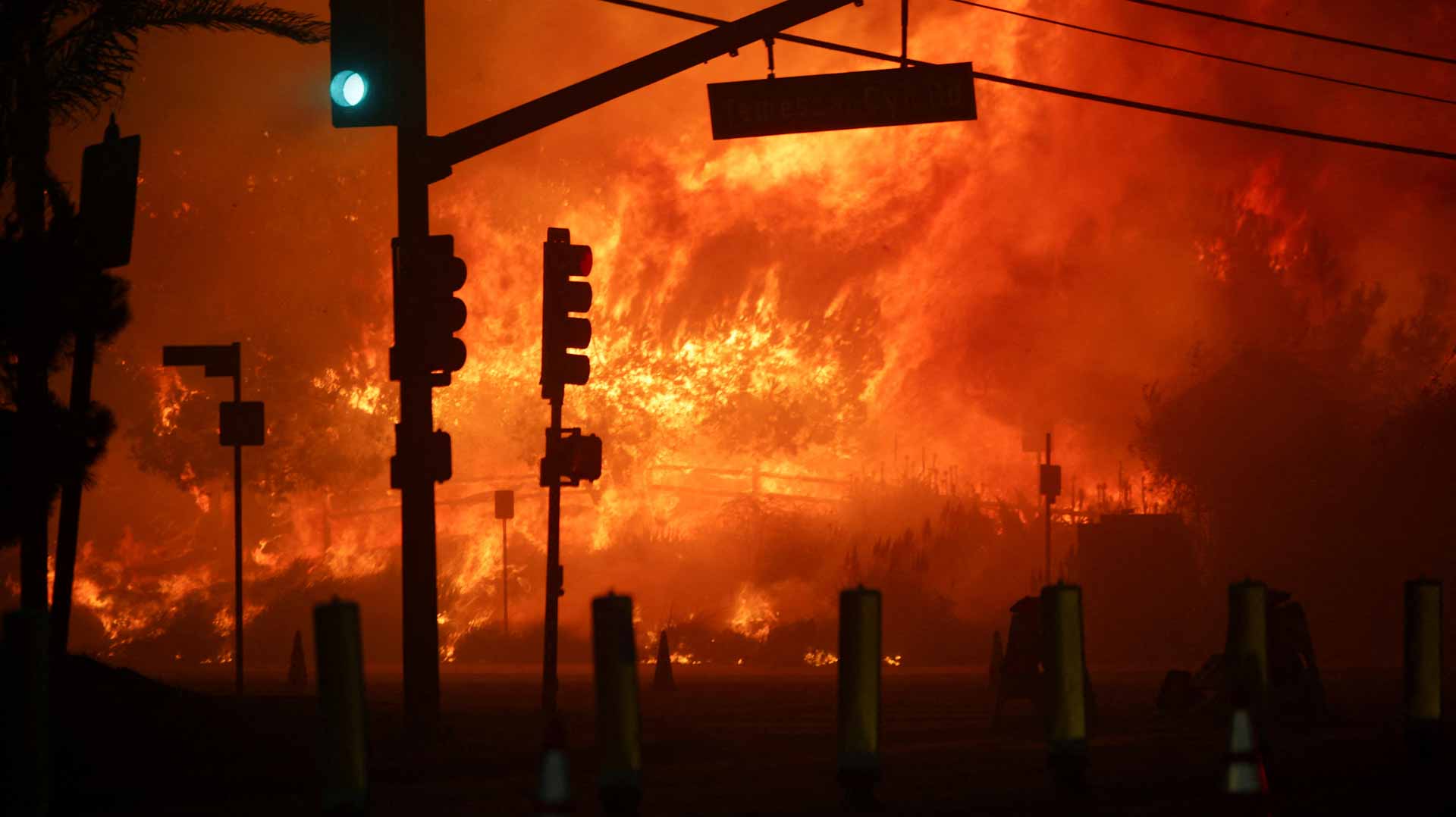 Wildfire sparks panicked evacuations in Los Angeles suburb 