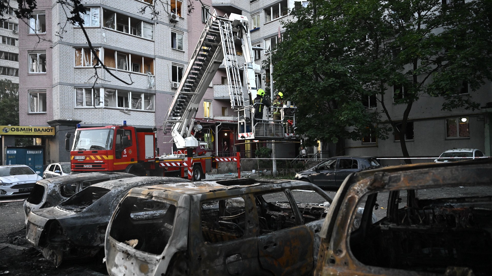 Image for the title: Russian strikes kill 10 in Kyiv as Ukraine hits cargo ship 