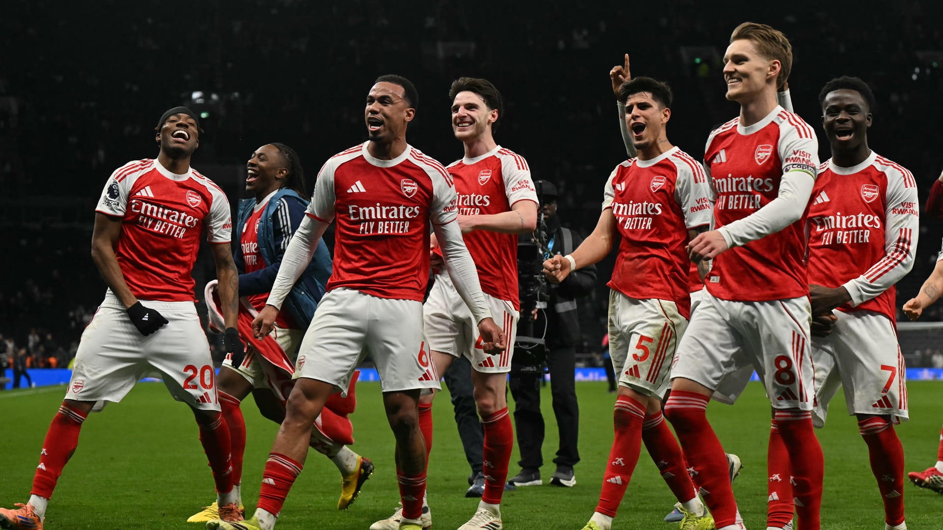 Arsenal hit four past Tottenham to stay top
