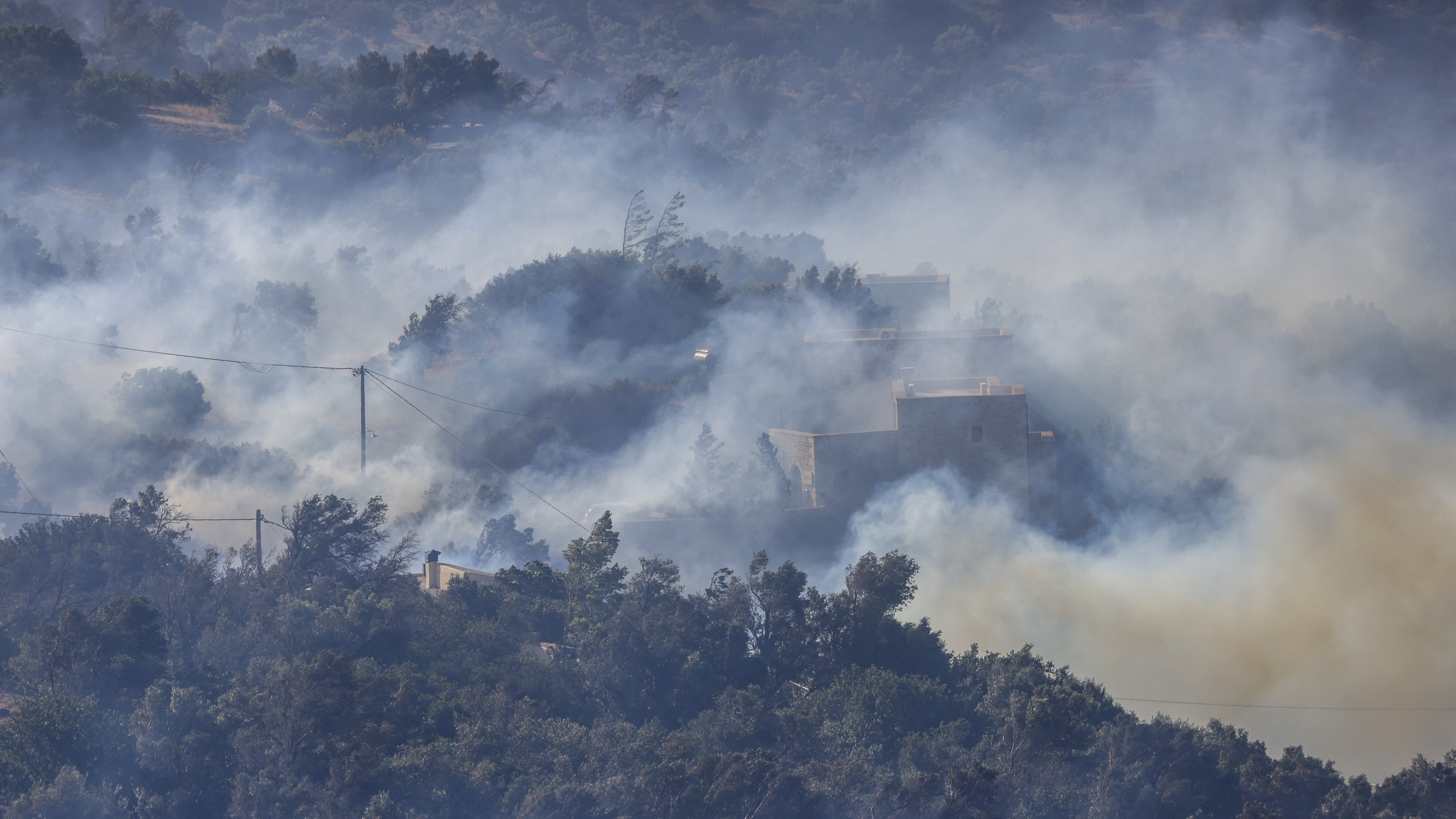 Image for the title: Strong winds fuel Greece, Turkey wildfires 