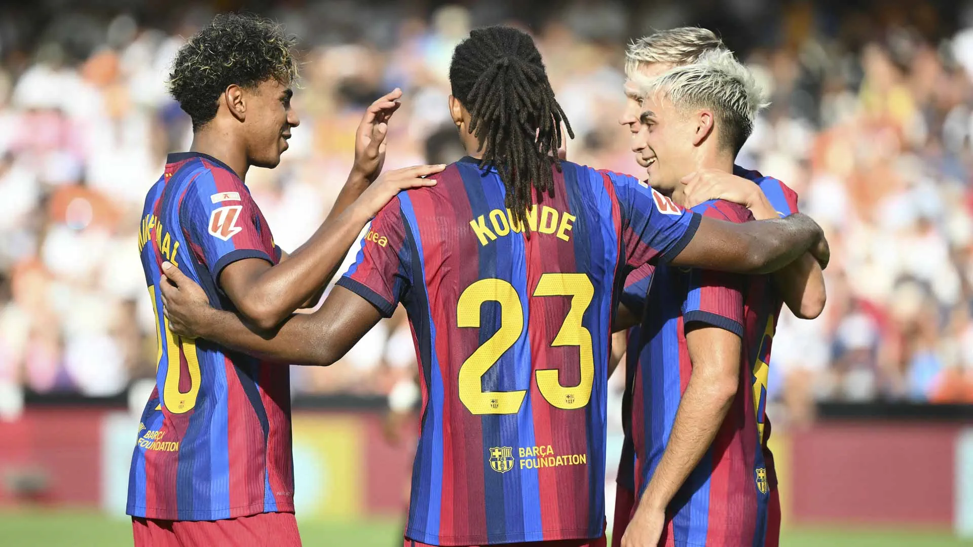 Barcelona put five past Valencia to stay perfect